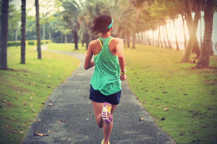 woman running on a path in the park