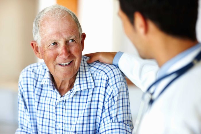 Older man talking with his doctor