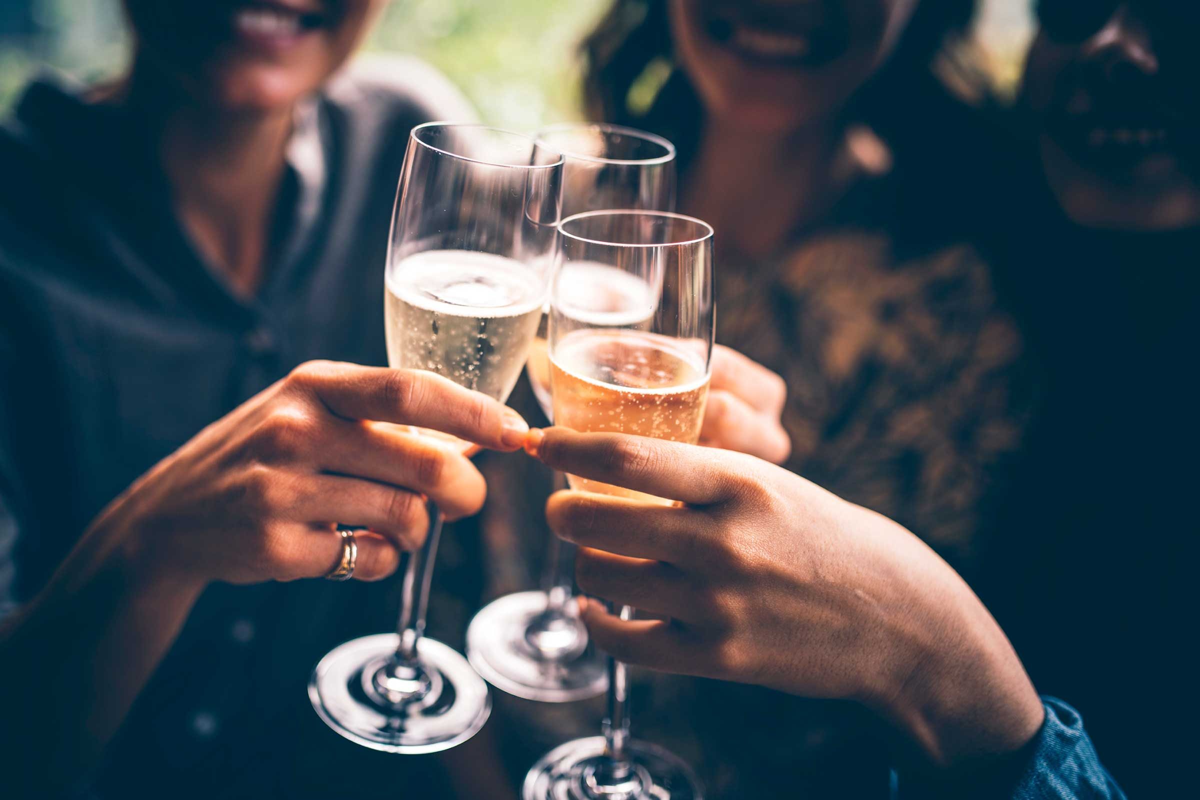 people toasting with champagne flutes