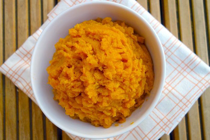 Bowl of mashed sweet potato.