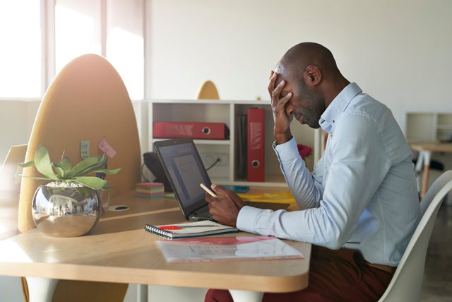 man stressed out from work