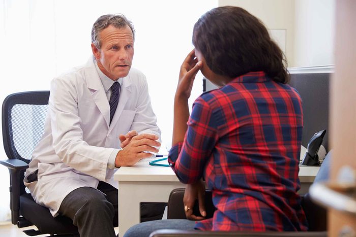Patient and doctor talking in office