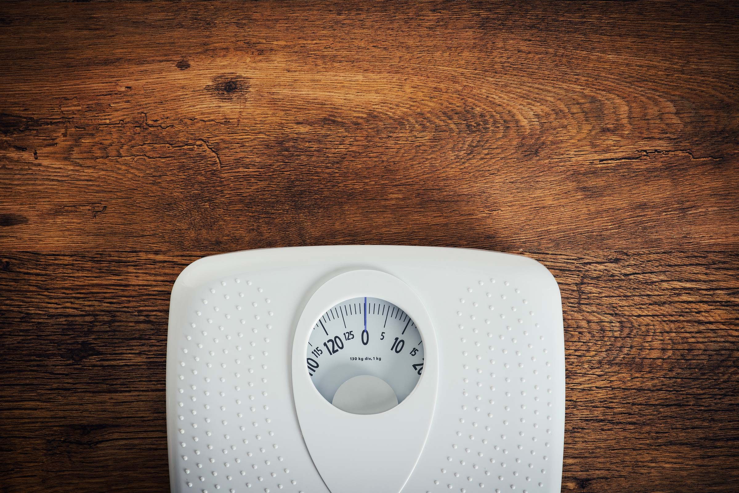 scale on a wood floor