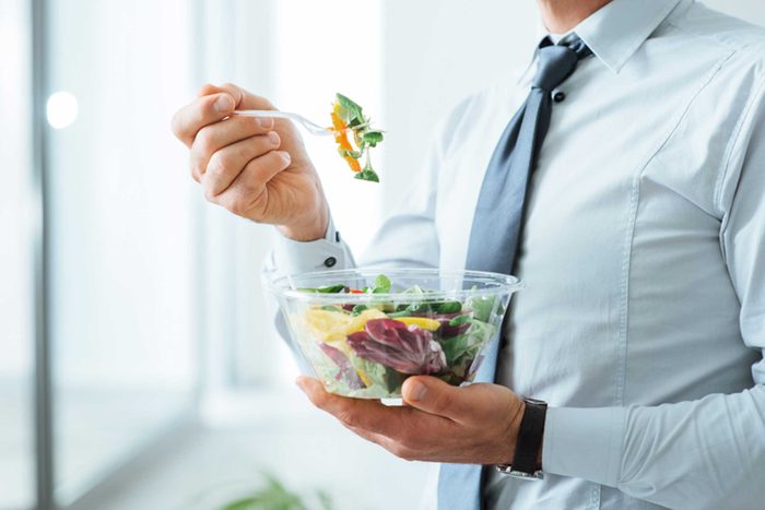 Man holding salad bowl
