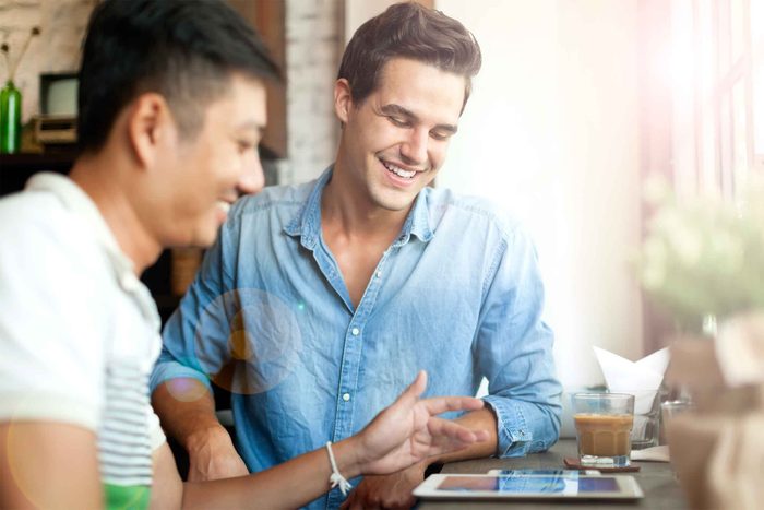 friends looking at tablet together