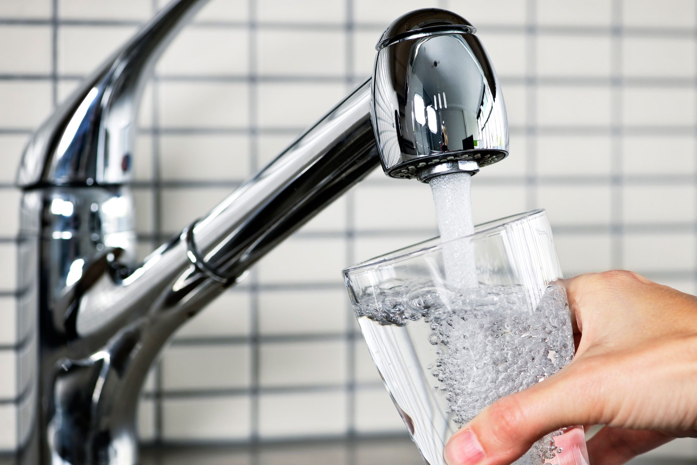 tap pouring water in glass