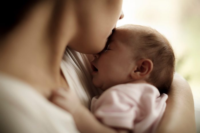mother holding baby