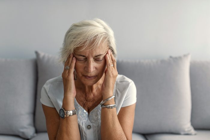 woman suffering from painful headache