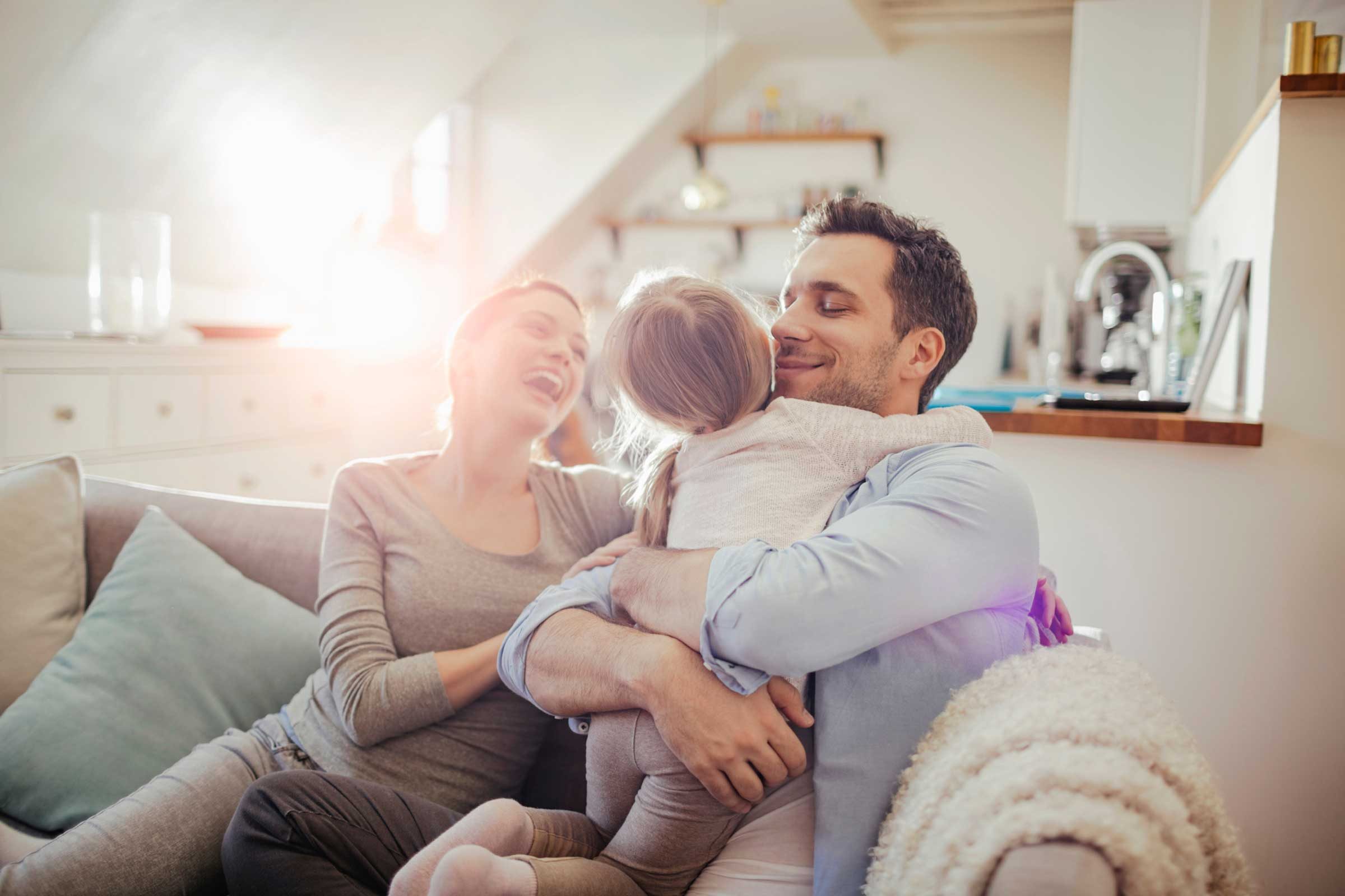 parents hugging child