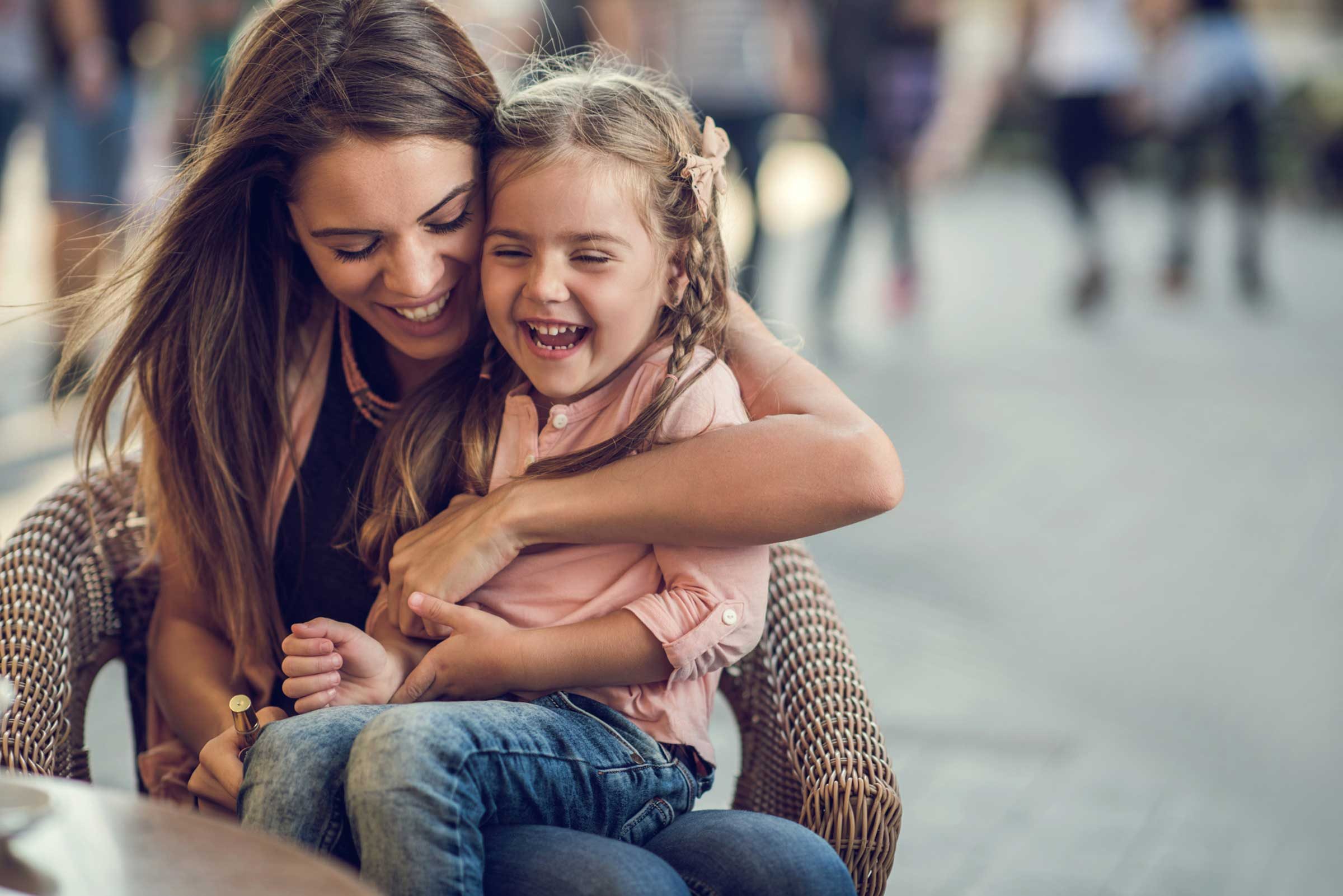 mom hugging daughter
