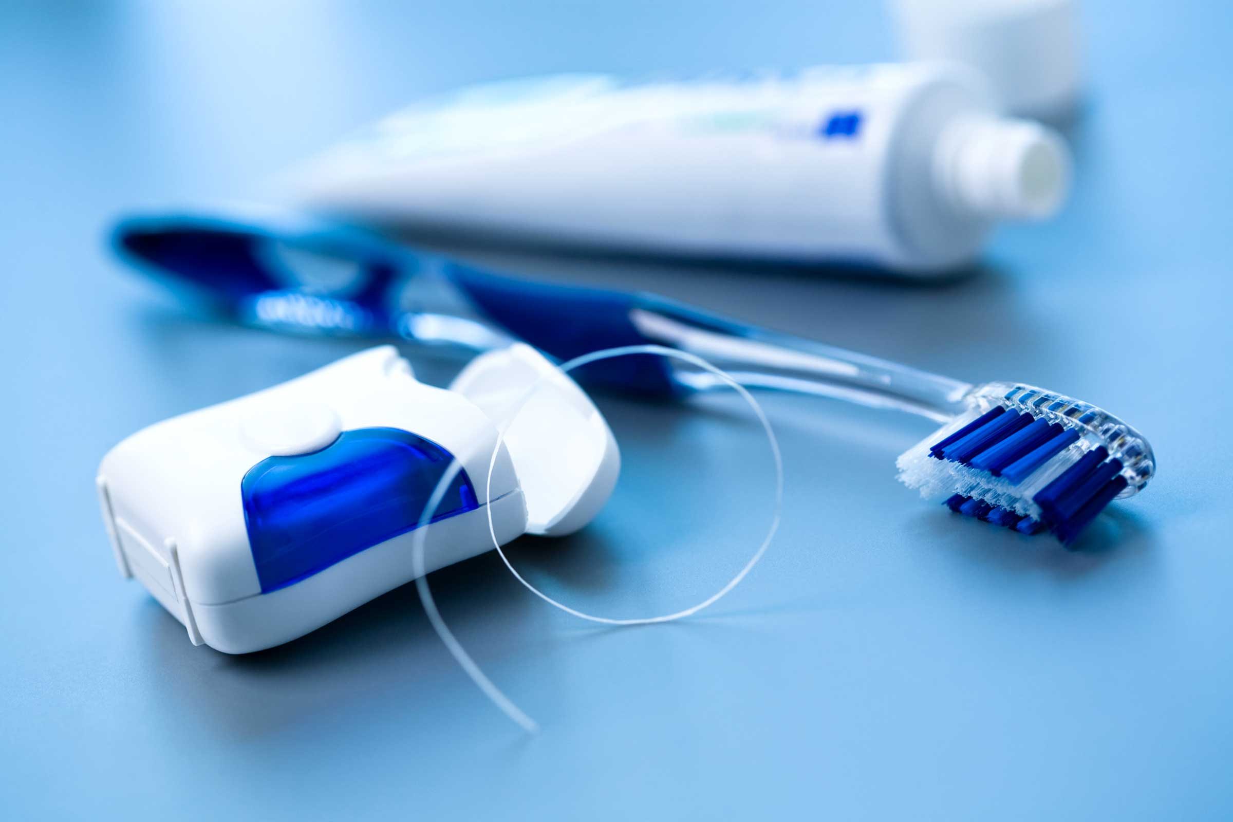 dental floss, toothbrush, toothpaste