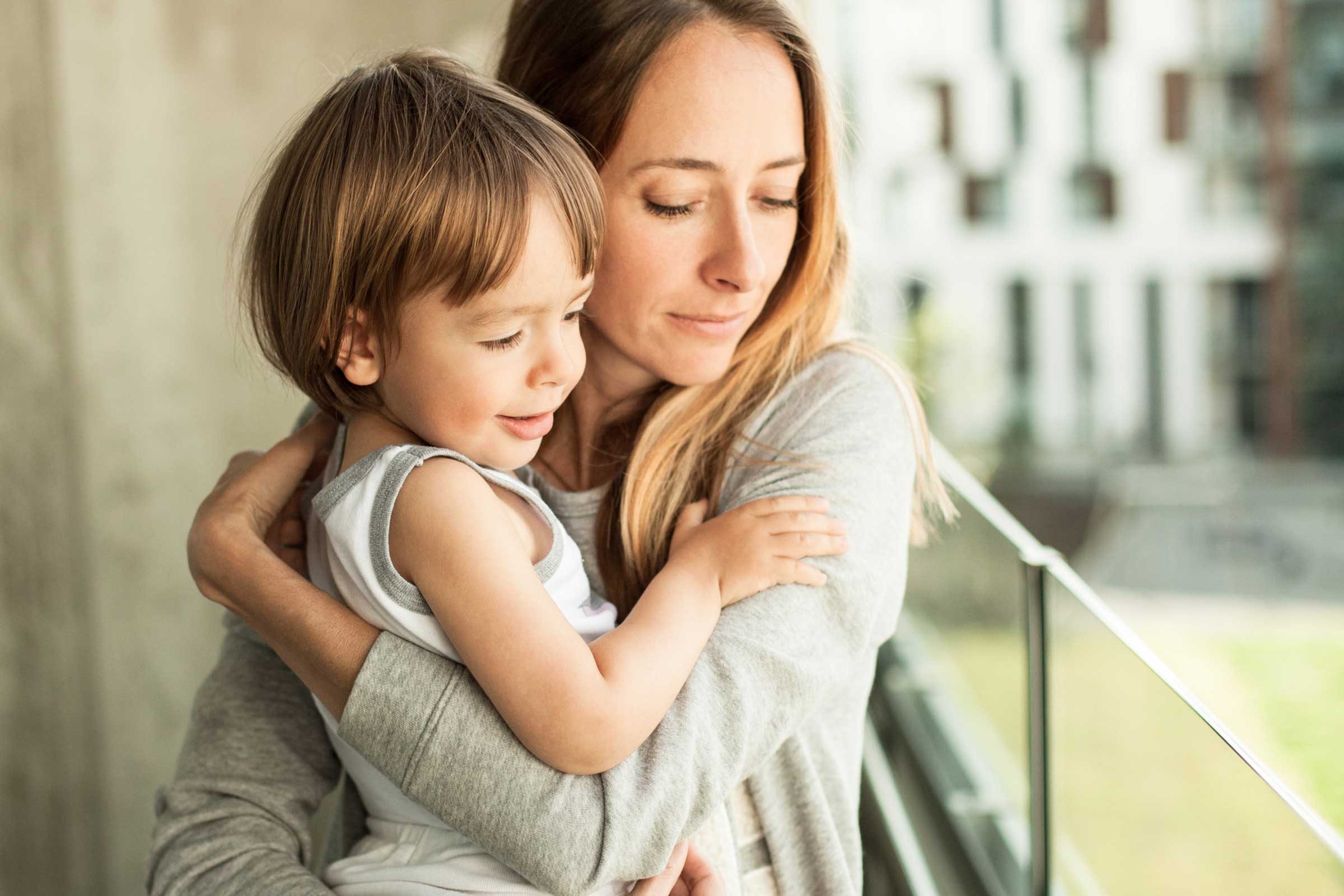 mother hugging child