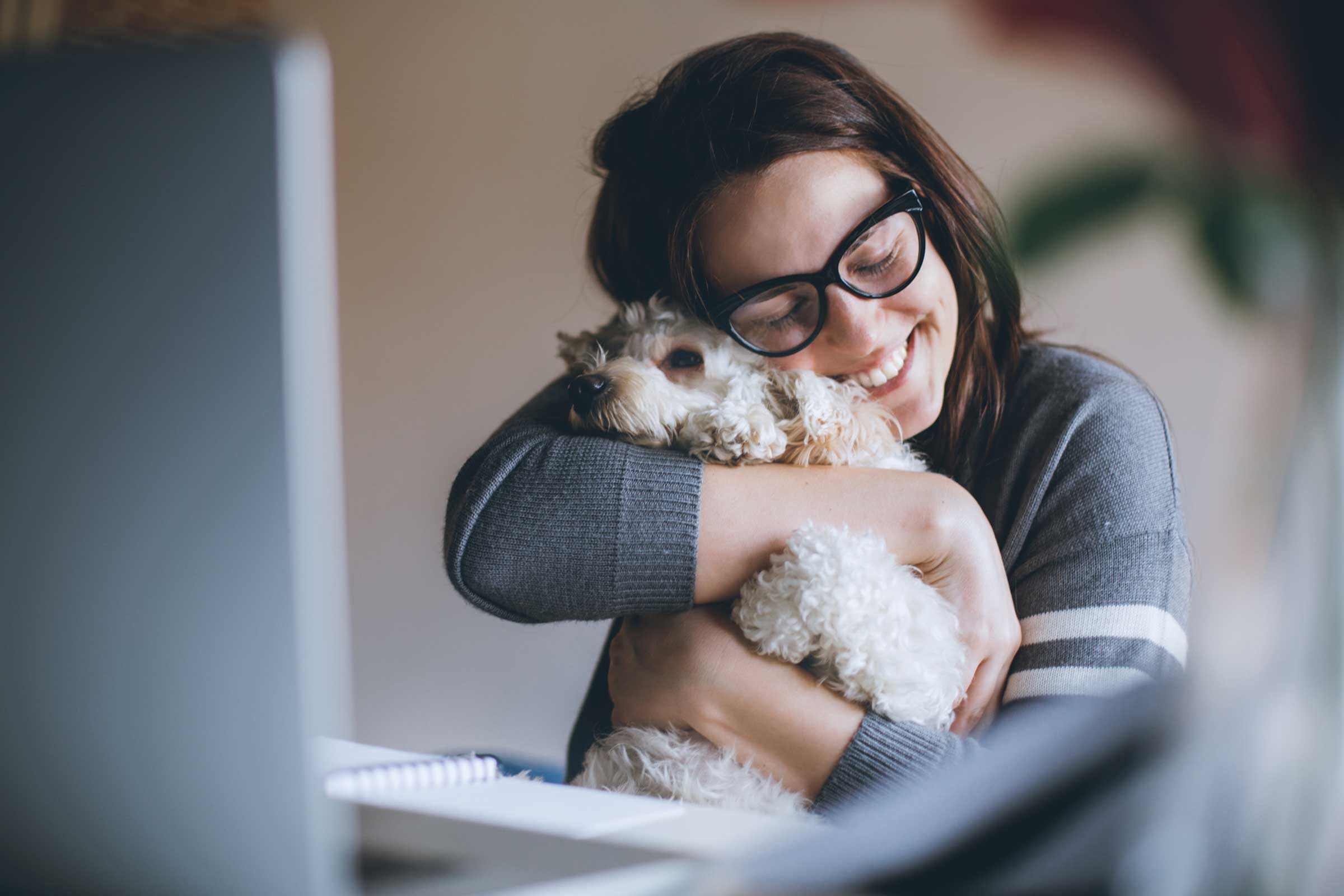 woman hugging dog