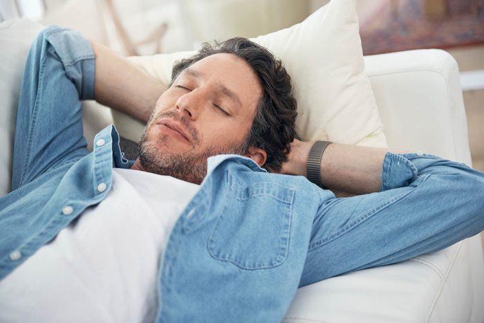 Man sleeping on couch.