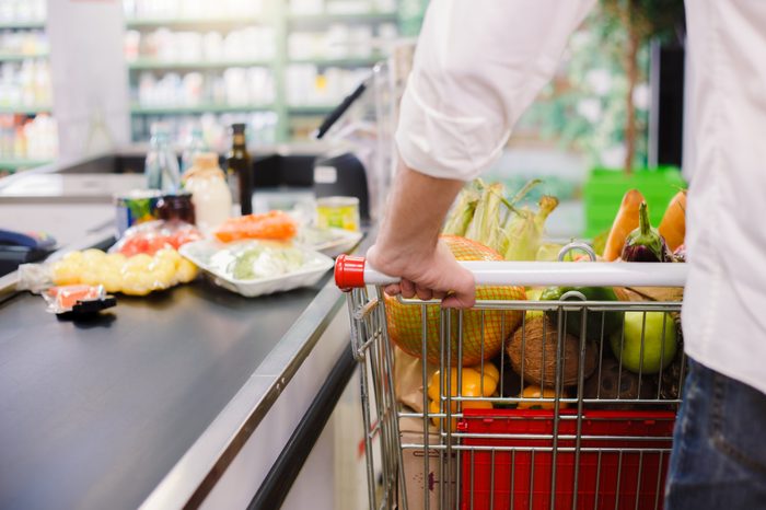 man in grocery store check out line