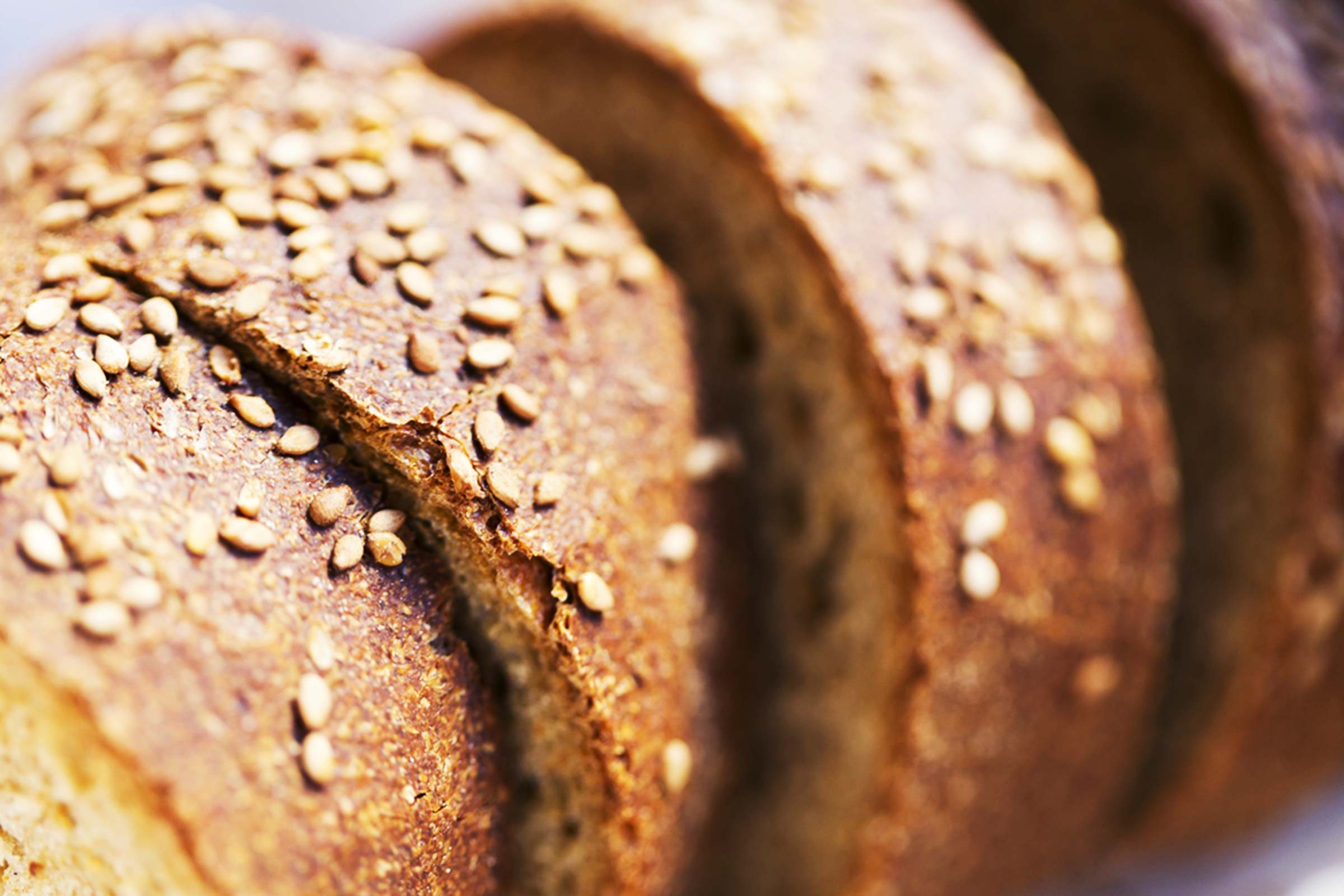 Sliced bread topped with sesame seeds.