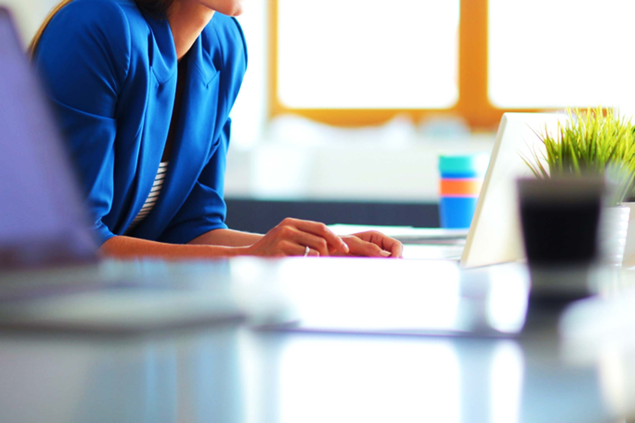 Woman sitting at her desk.