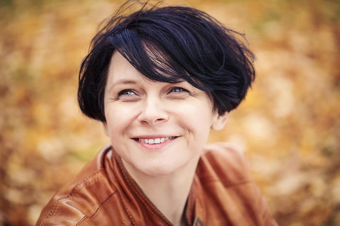Woman with short hair and bangs.