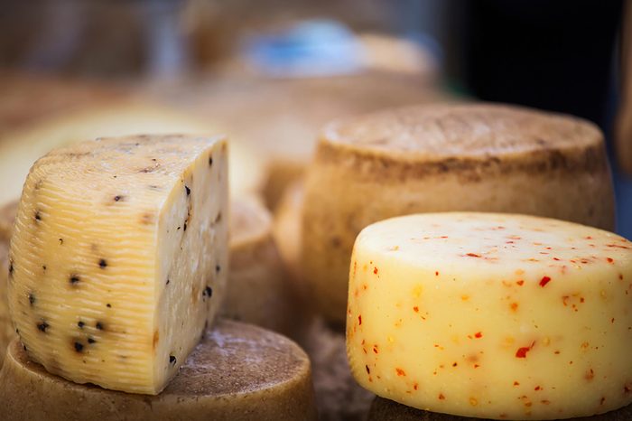 Wheels of aged cheese.