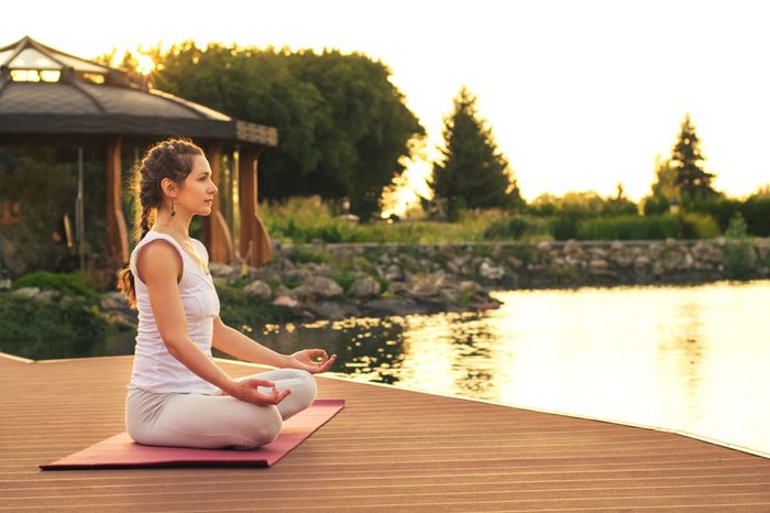 woman meditation on a dock