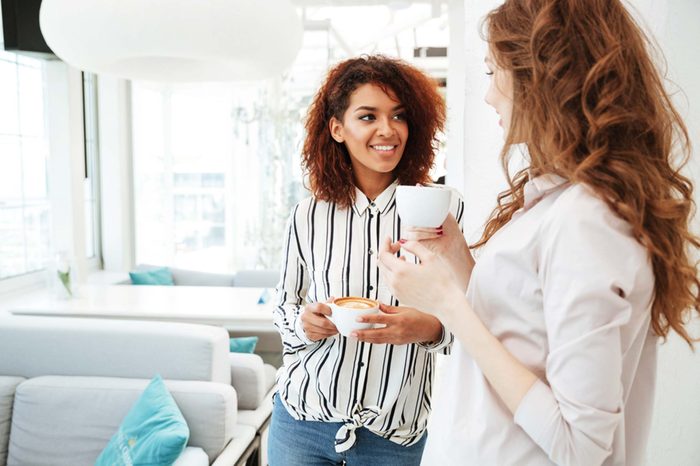 Two women chatting over coffee