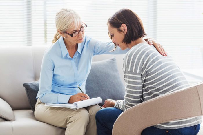 therapist consoling a patient