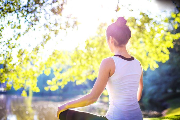 woman doing yoga outdoors
