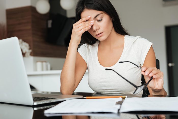 woman at computer with tired eyes