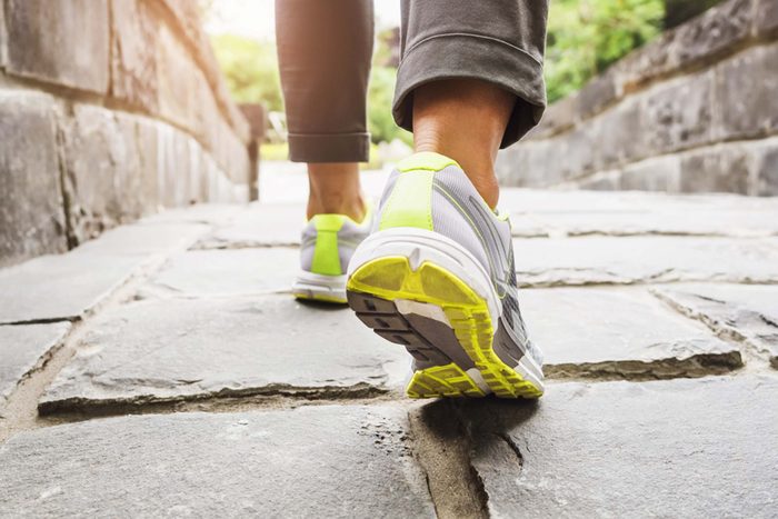 close up of sneakers, from behind, of a person walking