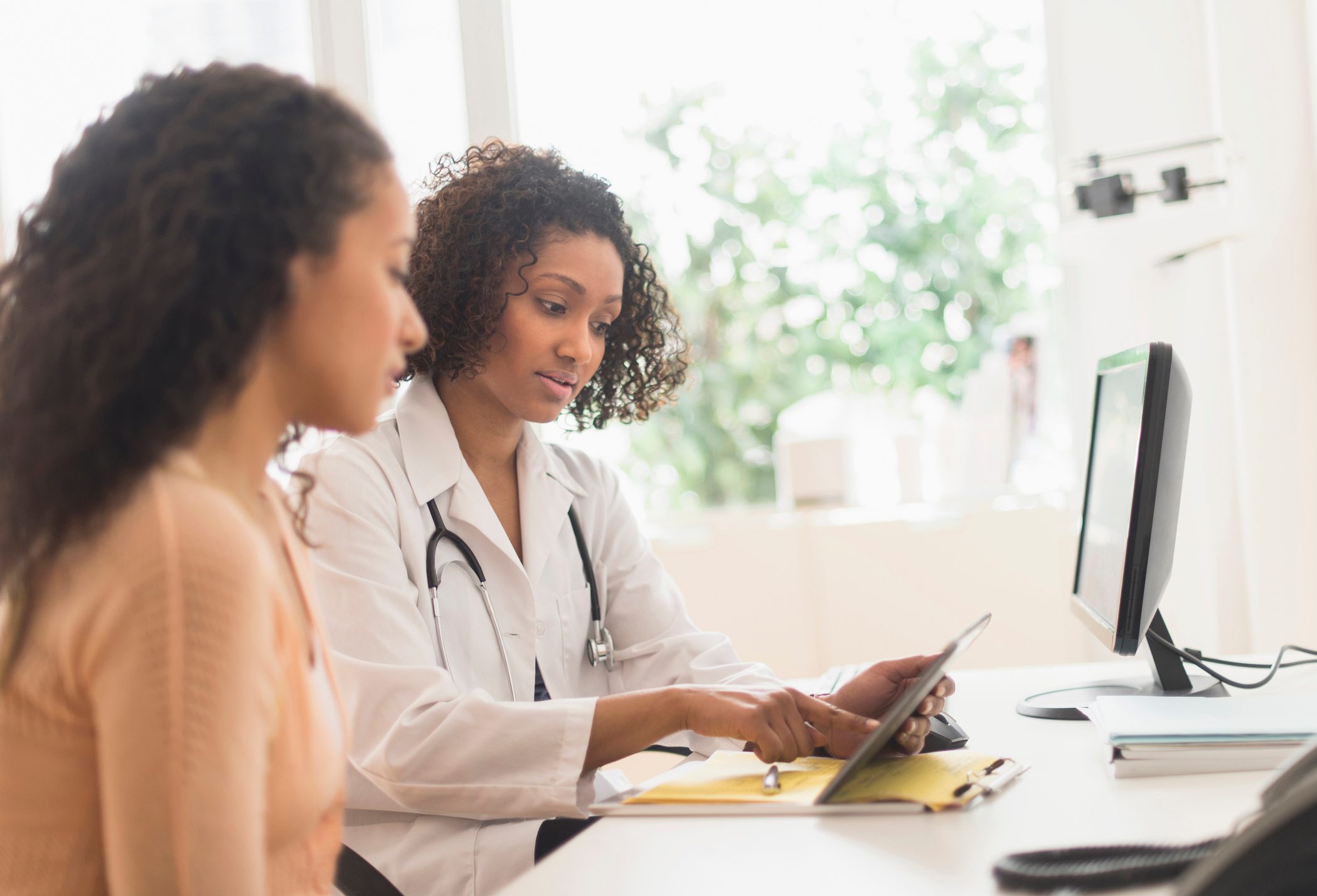 woman talking to doctor