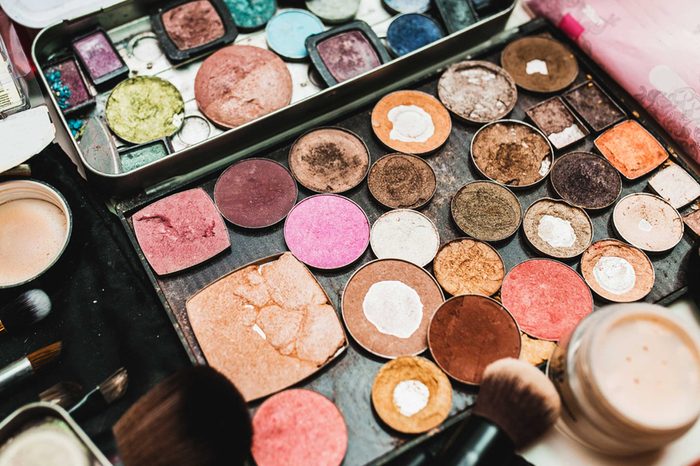 Old makeup powders and bronzers in an old case.