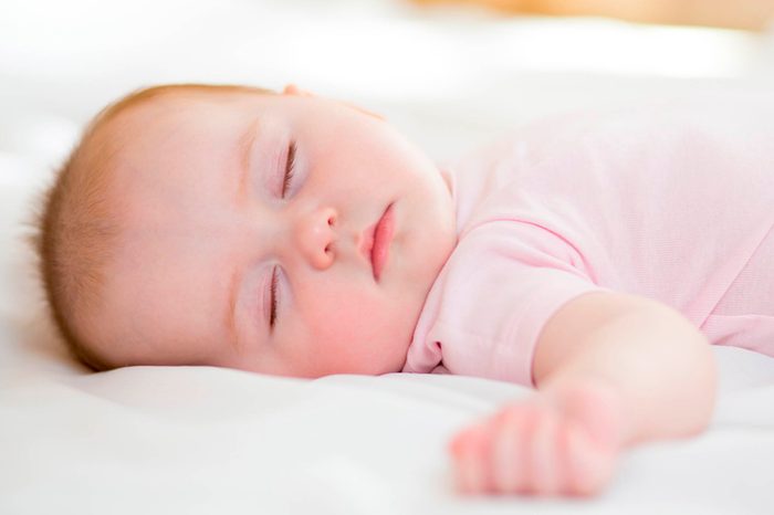baby asleep on her back