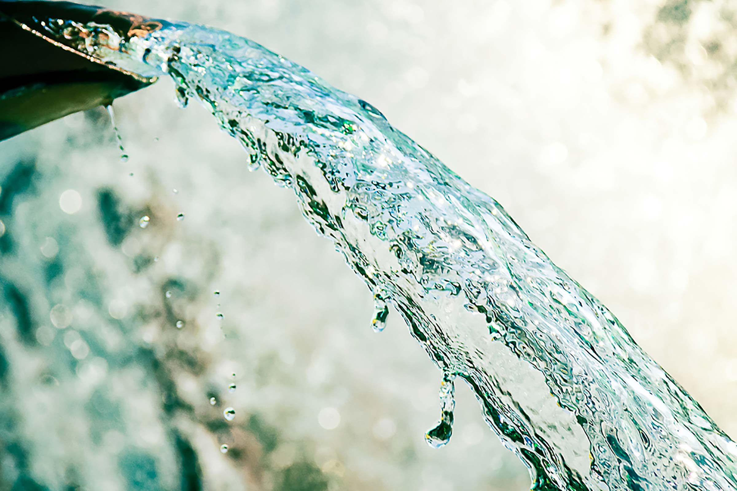Clean water coming out of a tap.