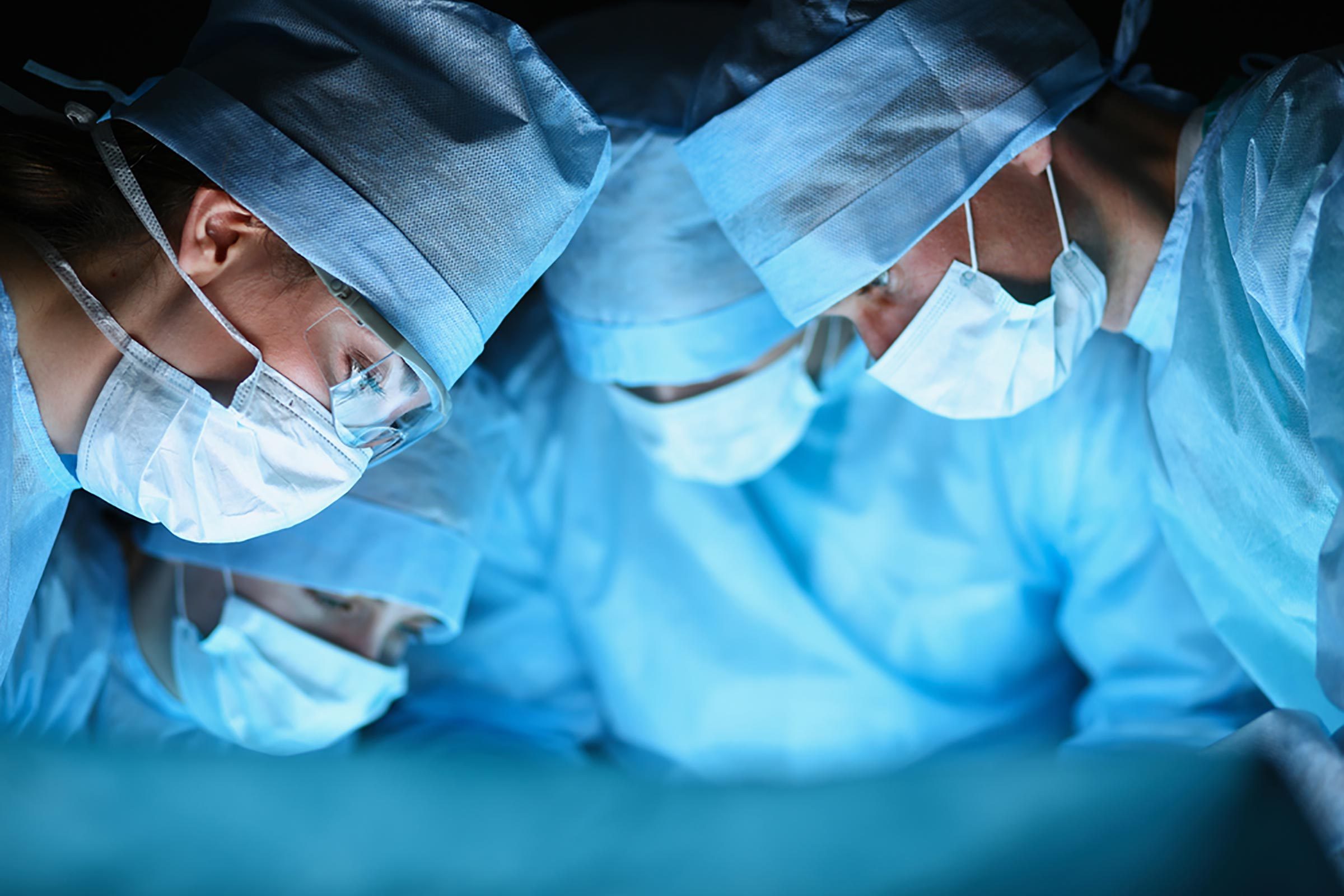 doctors in surgery with facemasks