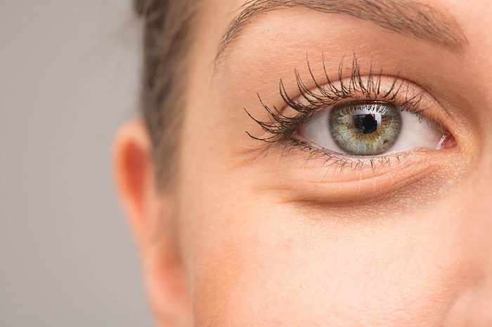 A woman with green-blue eyes.
