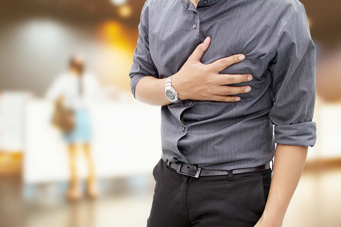 man holding his chest