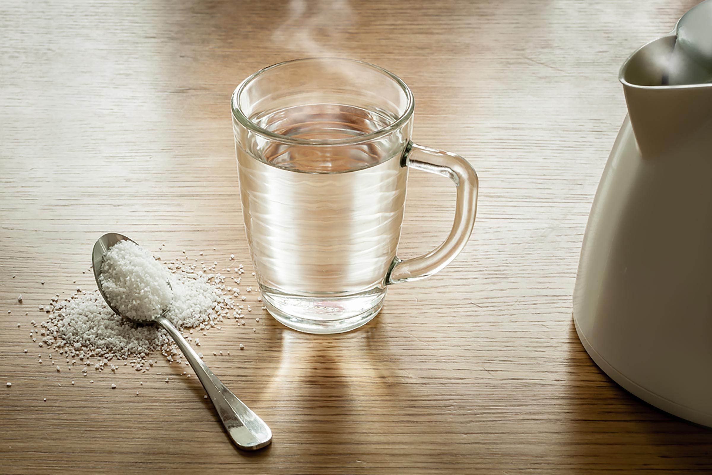glass with spoon of epson salt for laxative