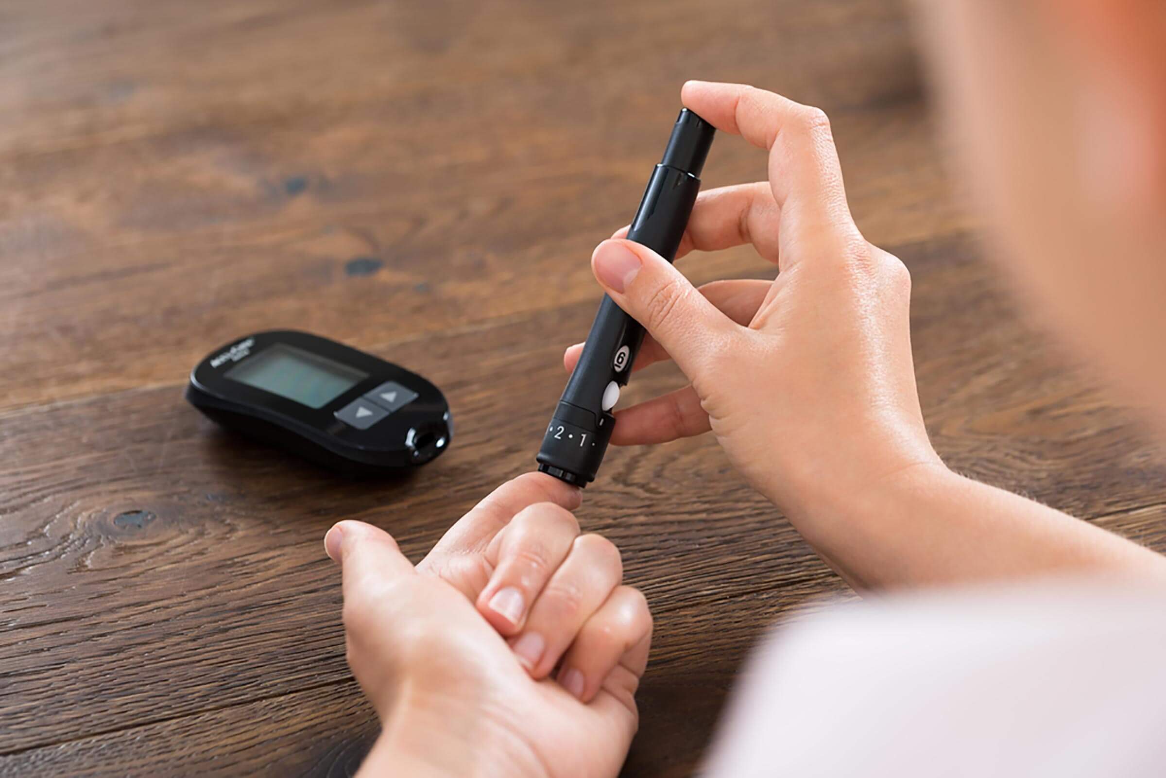 person checking blood sugar