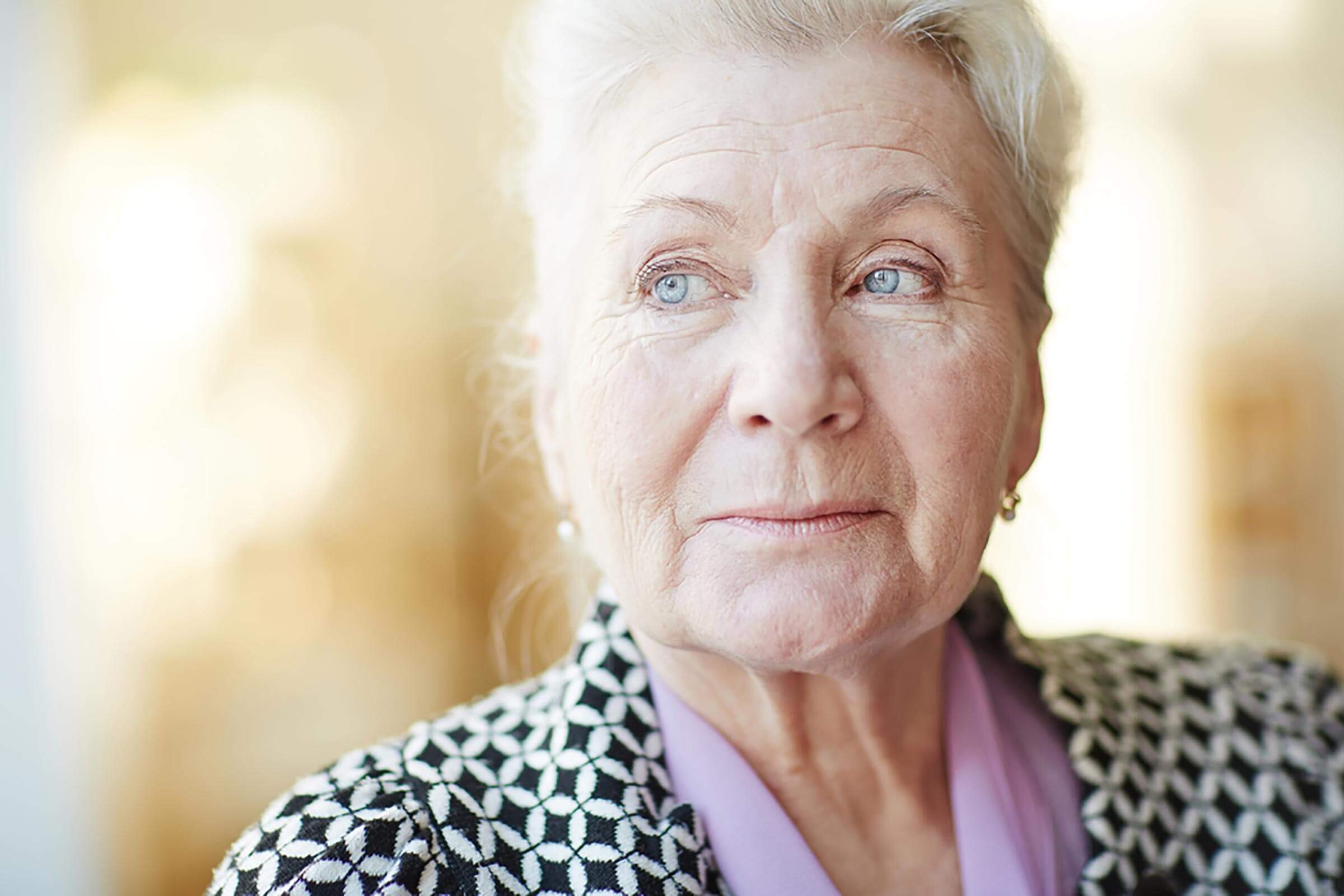 older woman looking into the distance