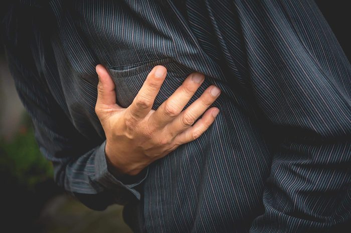 closeup of man clutching his chest