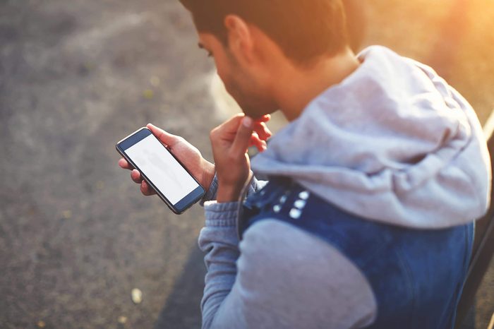 man looking at his smartphone