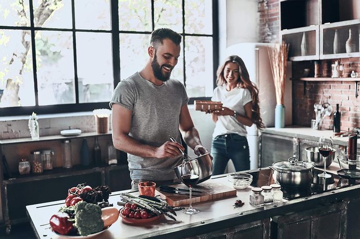 couple preparing a meal together in their kitchen