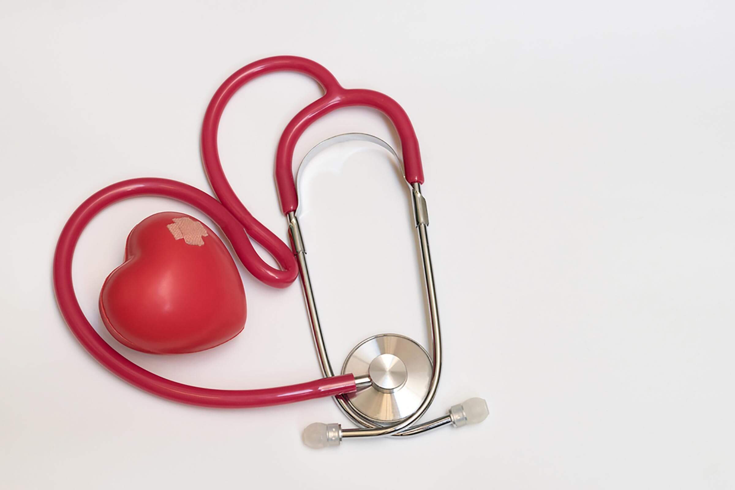 Heart toy with band-aids and stethoscope
