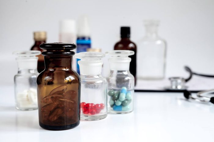 Glass jars of pills: a home first aid kit.