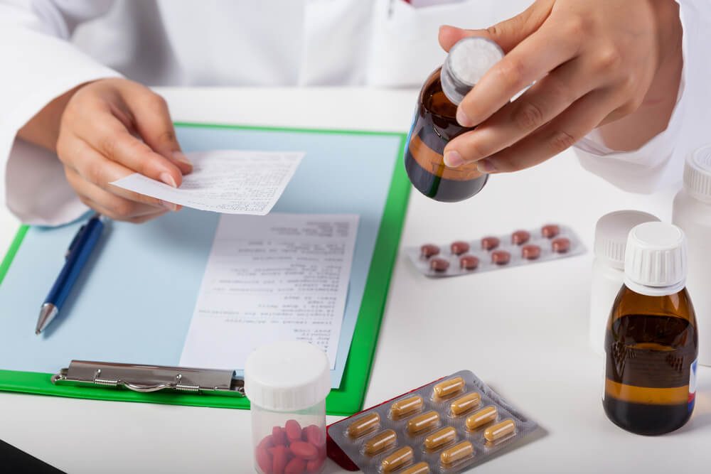 Horizontal view of pharmacist working in pharmacy