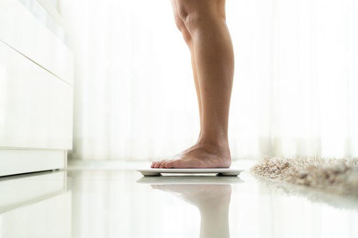 woman weighing herself