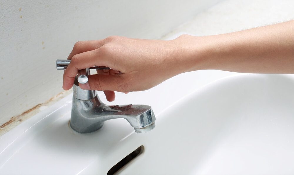 hand Turn off water valves. 