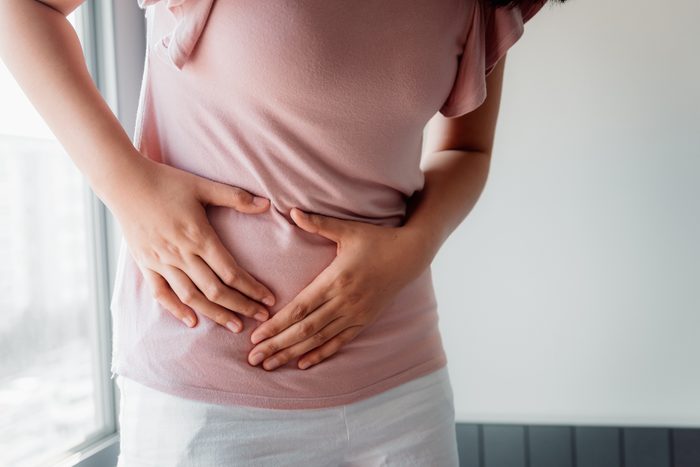 midsection of woman with stomach pain