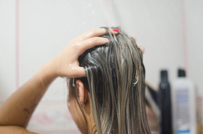 woman washing hair in the shower