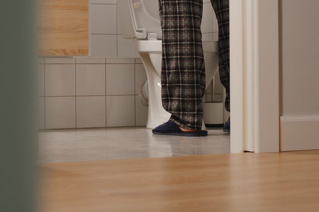 man peeing at night